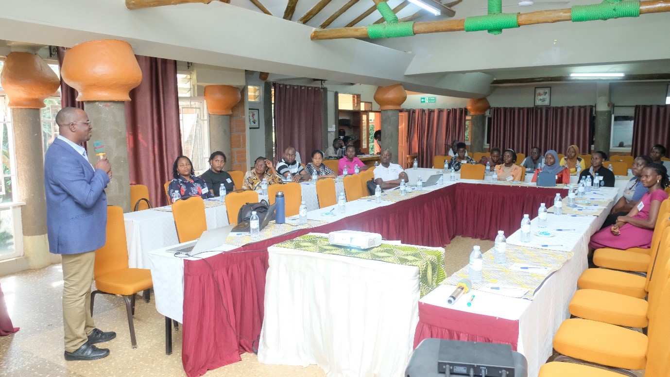 Dr Aloysius Senyonjo , a health policy expert and senior lecturer  at the Dept of Health Policy Planning and Mgt at Makerere University School of Public Health delivering the training to the participants