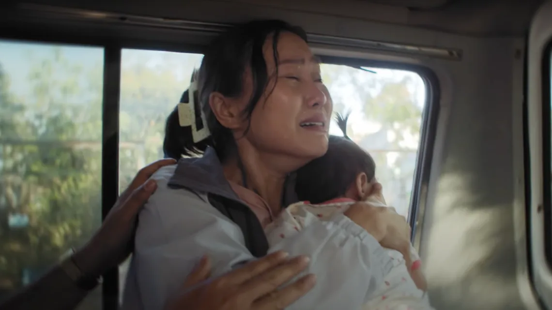 Mother shielding her child