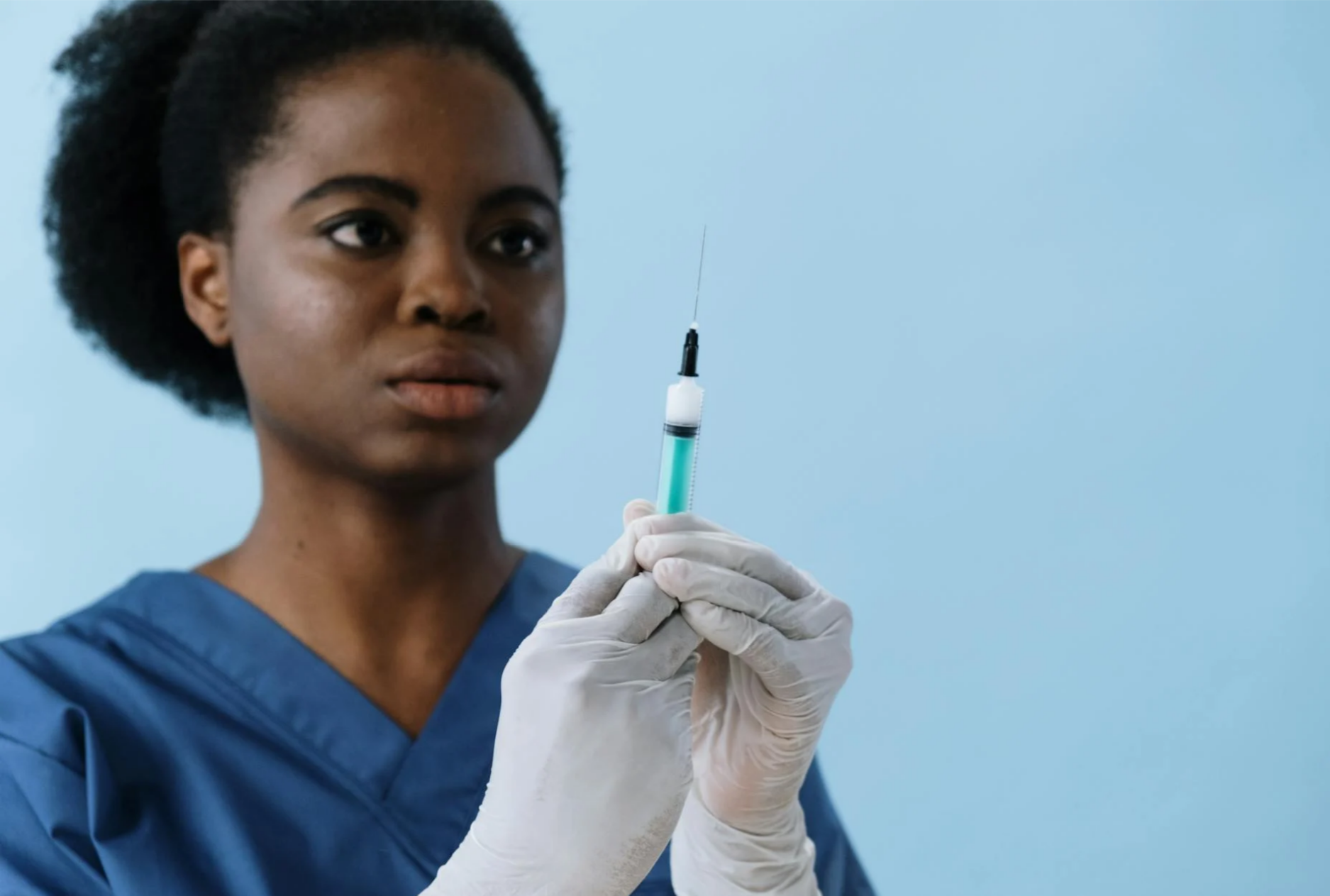 African Nurse holding syringe